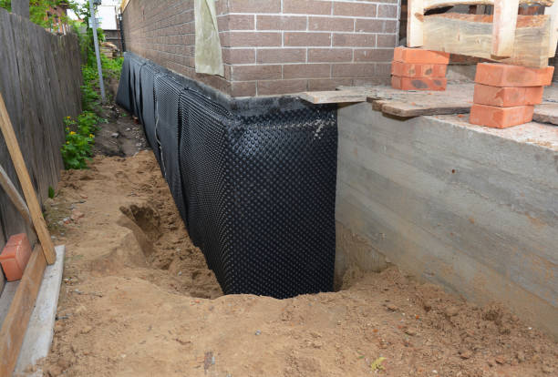Happy homeowners after waterproofing job in Amherst Junction